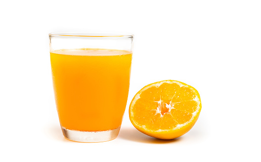 Freshness orange juice in clear glass slice orange on white background.
