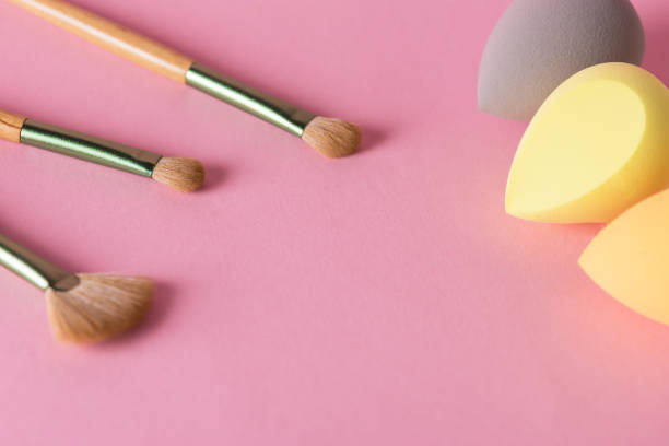 istock Makeup Accessories Brushes and Sponges Pink Pastel Background Copy Space 1445705552