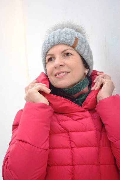 istock girl in winter clothes 1445708003