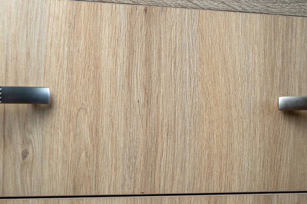 istock closeup of natural wooden wardrobe drawer front with handle 1445708075