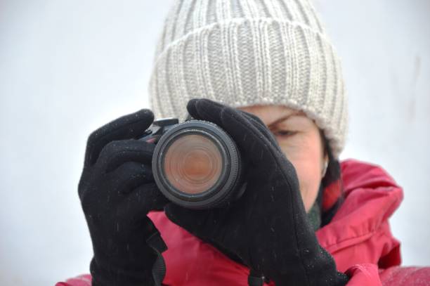 istock girl with a camera in her hands 1445708214