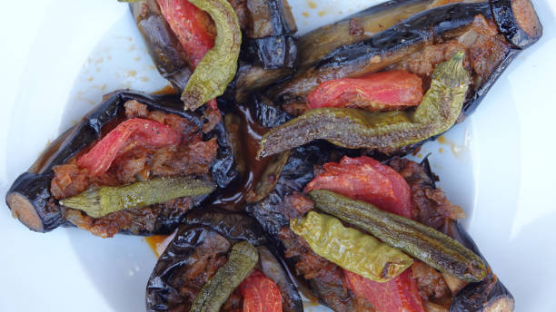 istock Turkish dish made of fried eggplant, minced meat, pepper, tomato or split aubergines with meat filling 1445708708