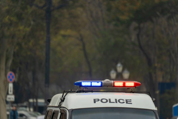 istock Police car driving through the city 1445714072