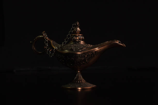 istock Aladdin's magic lamp isolated on black background 1445717702
