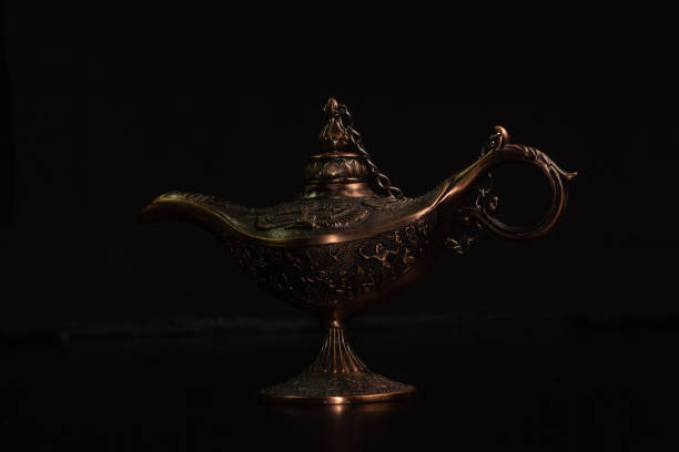 istock Aladdin's magic lamp isolated on black background 1445717716