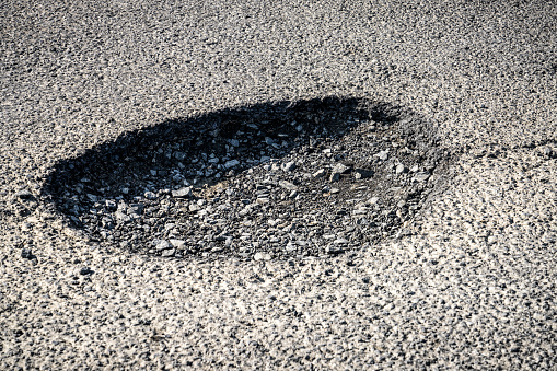 A dangerous pothole on a UK road..