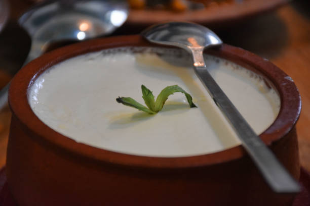 istock Buffalo yogurt in a ceramic bowl on the table and a spoon on it 1445719175