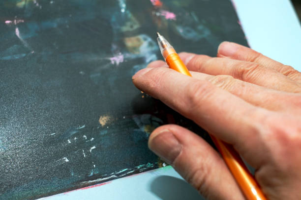 istock hand of artist with a pen 1445728594