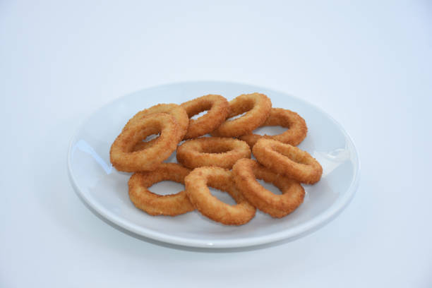 istock fried onion rings on white plate, isolated on white background 1445728879