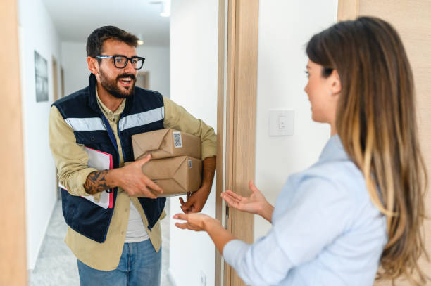 istock Woman received the parcel from the delivery man 1445729170