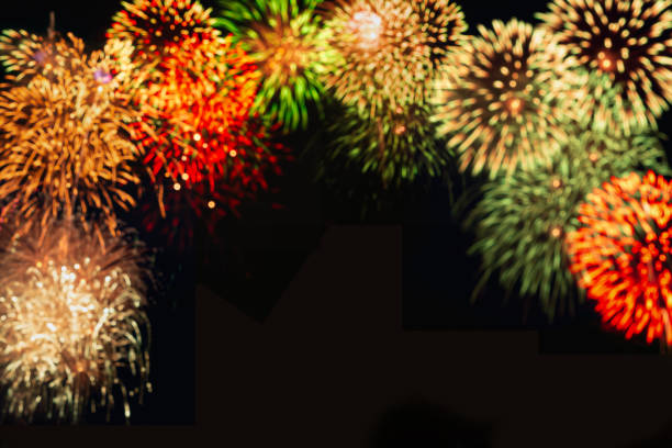 Red fireworks bloom on the dark sky