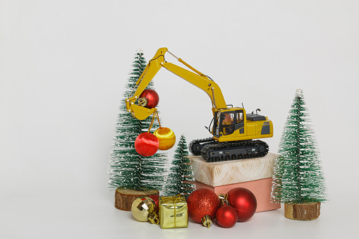 Christmas ornament with Excavator model ,  Holiday celebration concept new year on white background