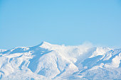 Winter volcanic peak and blue sky