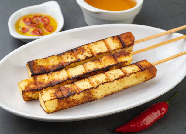 istock Grilled Rennet or Coalho cheese on a plate with sugar syrup and pepper 1445736040