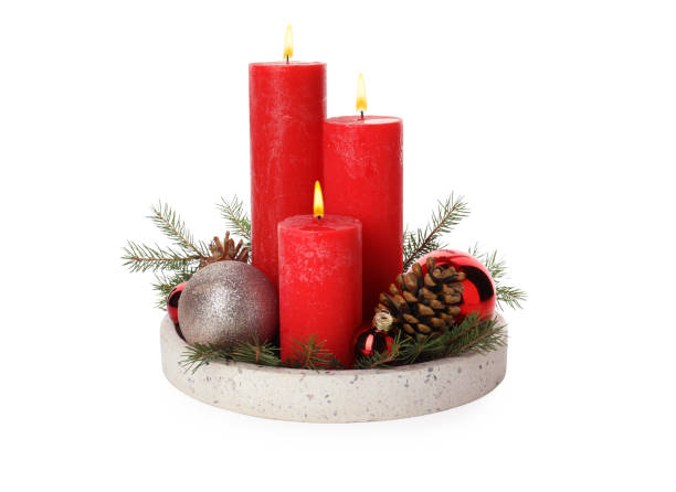 istock Beautiful burning candles with Christmas decor on white background 1445742710
