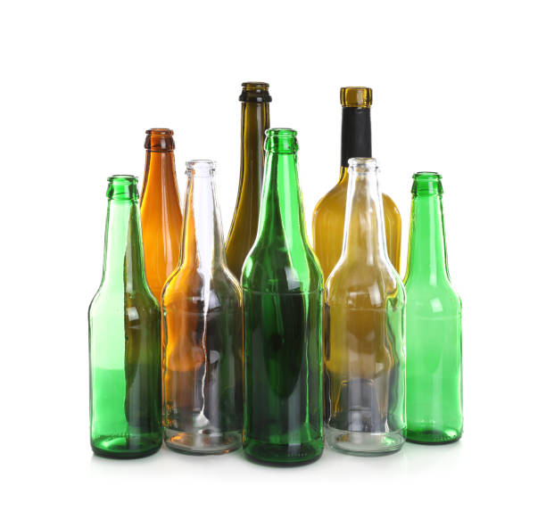 istock Many different glass bottles on white background. Recycling rubbish 1445743631