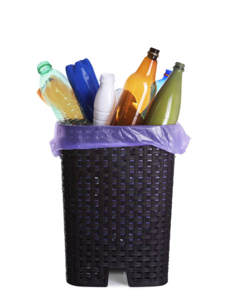 istock Trash bin full of plastic bottles on white background. Recycling rubbish 1445743801