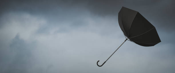 istock Wind blown umbrella. Very windy weather 1445748231