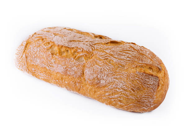 istock Black bread loaf closeup on white background 1445748659