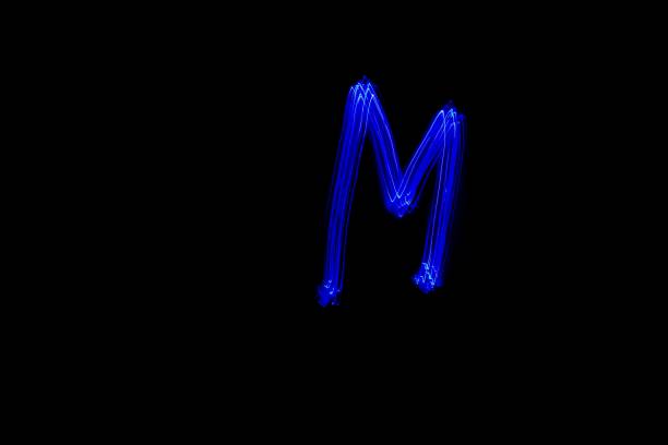 istock Light painting blue letter M on black background 1445749165