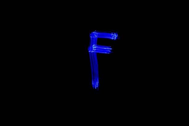 istock Light painting blue letter F on black background 1445749376