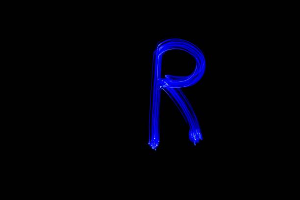 istock Light painting blue letter R on black background 1445749690