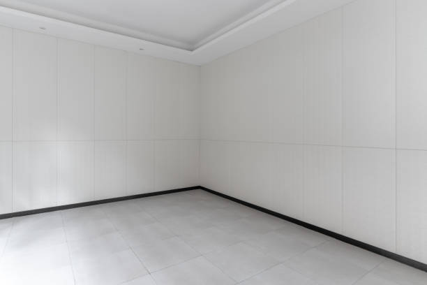 istock The wall and floor of an empty white room 1445758894
