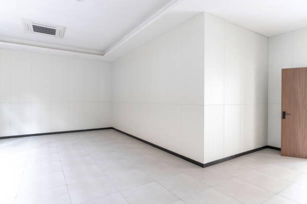 istock The wall and floor of an empty white room 1445758961