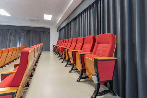 istock Small meeting room with red sofa chairs 1445760385