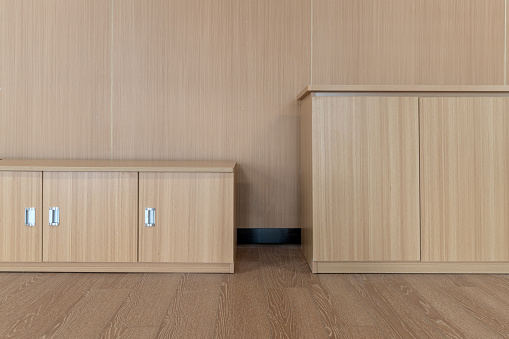 Wooden wall and floor and cabinets on the wall