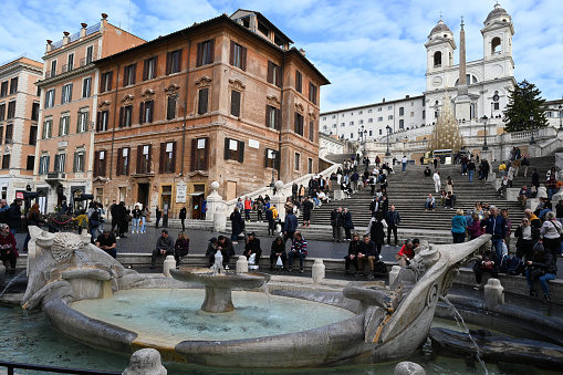 Rome, Italy, november 24, 2022 : Rome's Spanish Steps with the Barcaccia Fountain and the Church of the Trinity