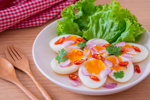 istock Spicy boiled eggs salad on white plate 1445763193