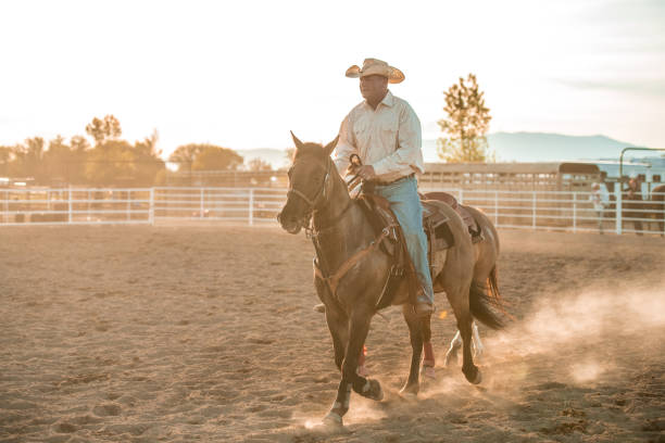 istock Cowboy Horseback Riding In A Rodeo Arena 1445763868
