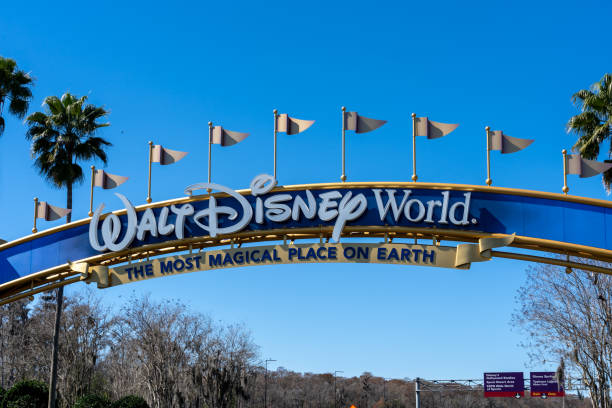 A Walt Disney World arch gate on the road in Orlando, Florida, USA. stock photo