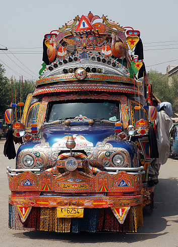 Peshawar, Khyber Pakhtunkhwa / Pakistan - Aug 15 2005: Colorful Bedford truck used as local transportation in Peshawar, Pakistan. Local bus in Peshawar, Pakistan.