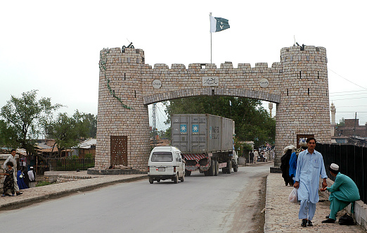 Khyber Pass, Peshawar, Khyber Pakhtunkhwa / Pakistan - Aug 16 2005: Monument on the road to the Khyber Pass in Peshawar, Pakistan. This gate is the start of the pass.