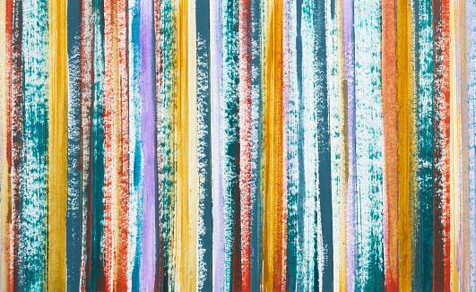 Multi-colored stripes painted with acrylic paint. Geometric abstract background.