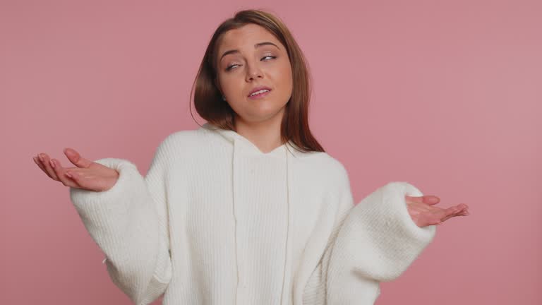 Woman raising hands asking what why reason of failure demonstrating disbelief irritation by troubles