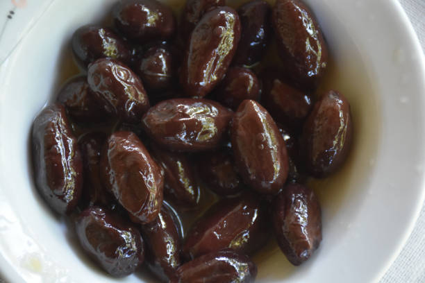 istock Black olives served in white bowl 1445771582
