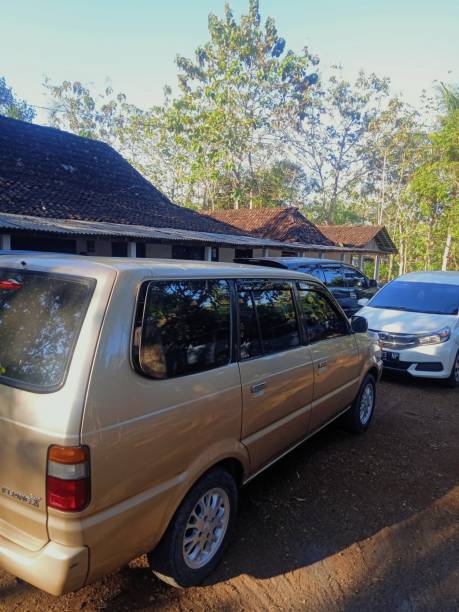 Toyota Kijang LGX (1999) 25 July 2021, Wonosari, DIY, Indonesia - Toyota Kijang LGX 1999, being parked side by side with other cars kijang stock pictures, royalty-free photos & images