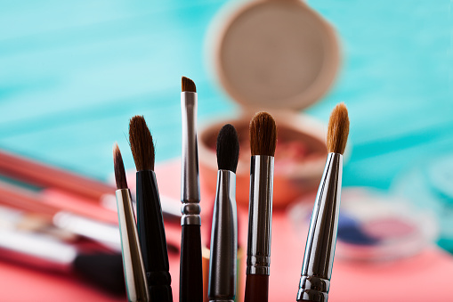 Makeup brushes selective focus. Beauty tools.
