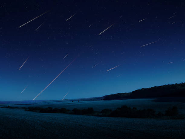 istock Meteors in the night sky over the fields. 1445783112