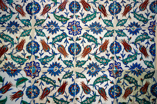 Seamless pattern white Turkish tiles with blue ornaments. Old surface texture, wall in mosque