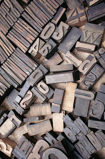 Box of old antique wooden printing blocks with a selection of old style typefaces