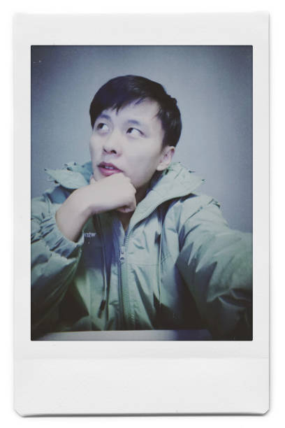 istock A man is taking a selfie with a Polaroid 1445790796