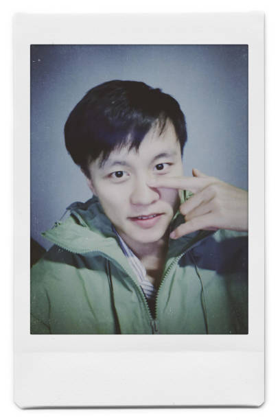 istock A man is taking a selfie with a Polaroid 1445790827