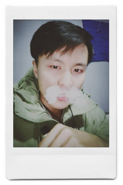 istock A man is taking a selfie with a Polaroid 1445790836