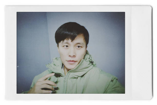 istock A man is taking a selfie with a Polaroid 1445790871