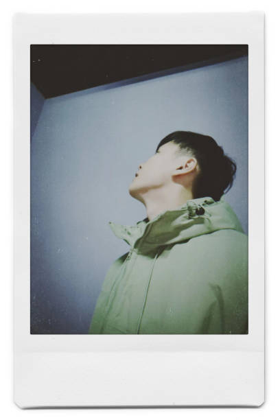 istock A man is taking a selfie with a Polaroid 1445790875
