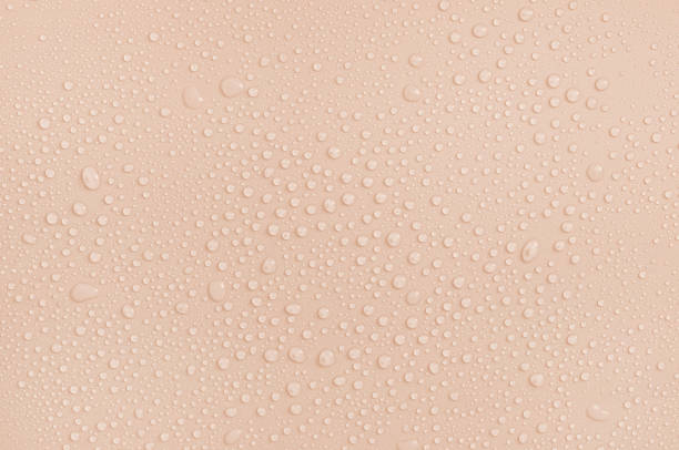 water drops on a pastel beige background